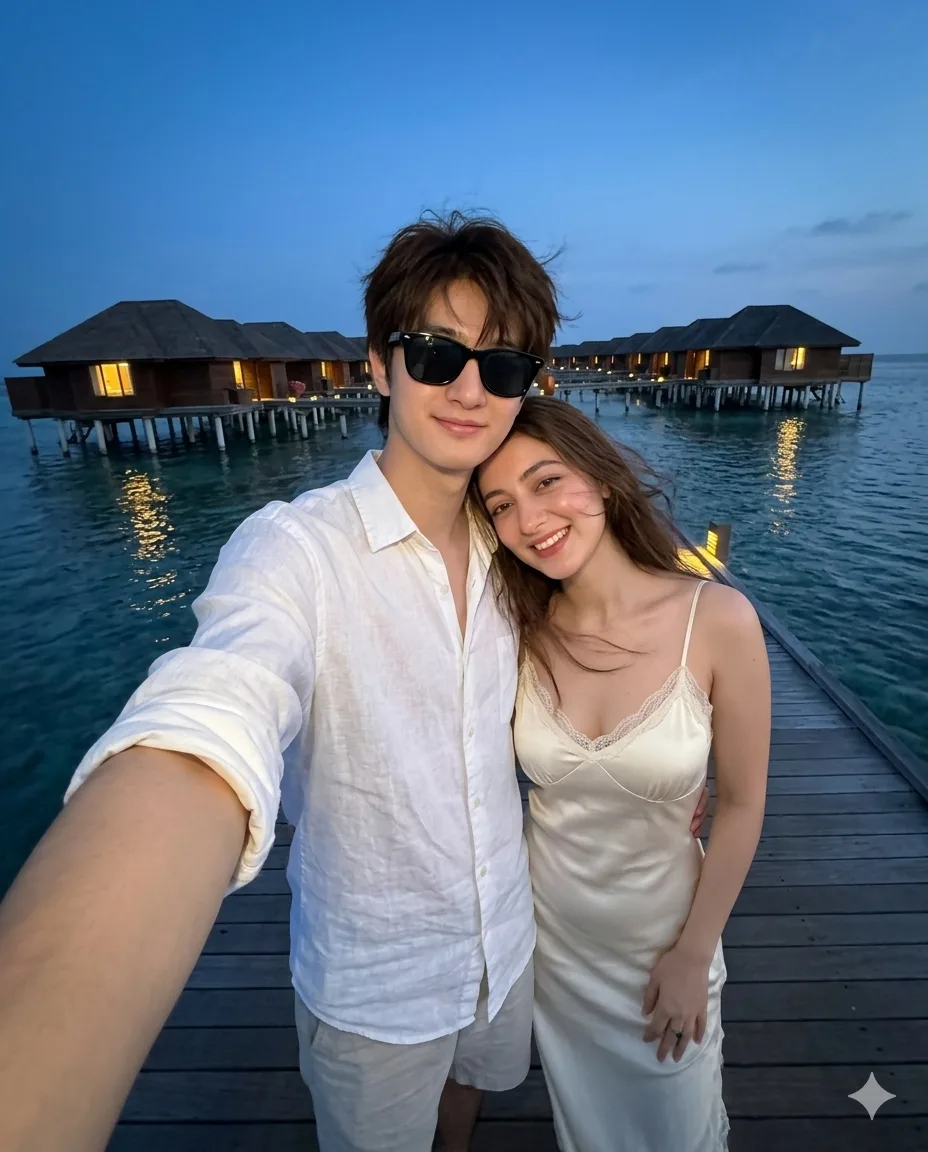 Blue-hour overwater-resort couple selfie