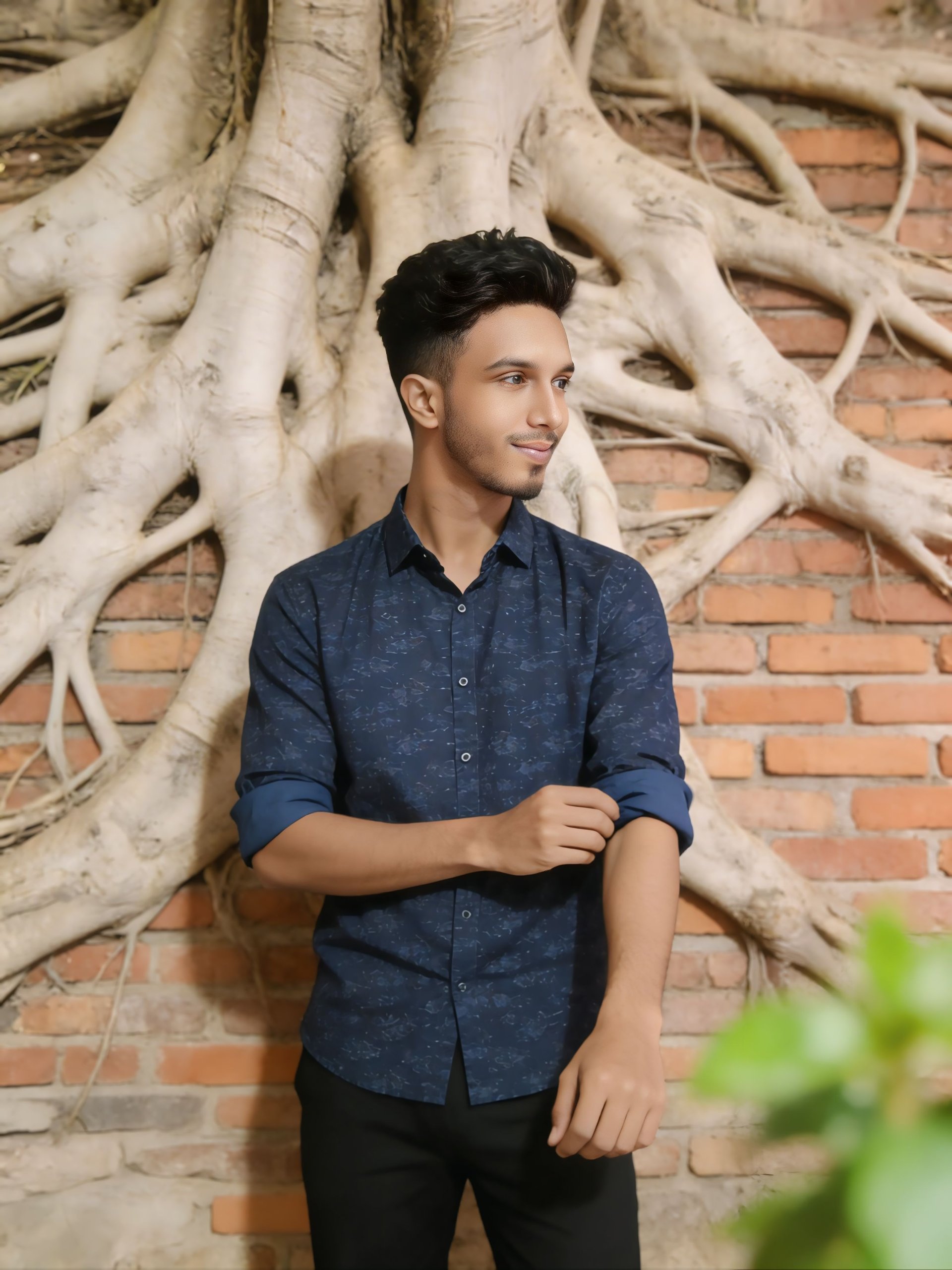 Standing against a rustic brick wall