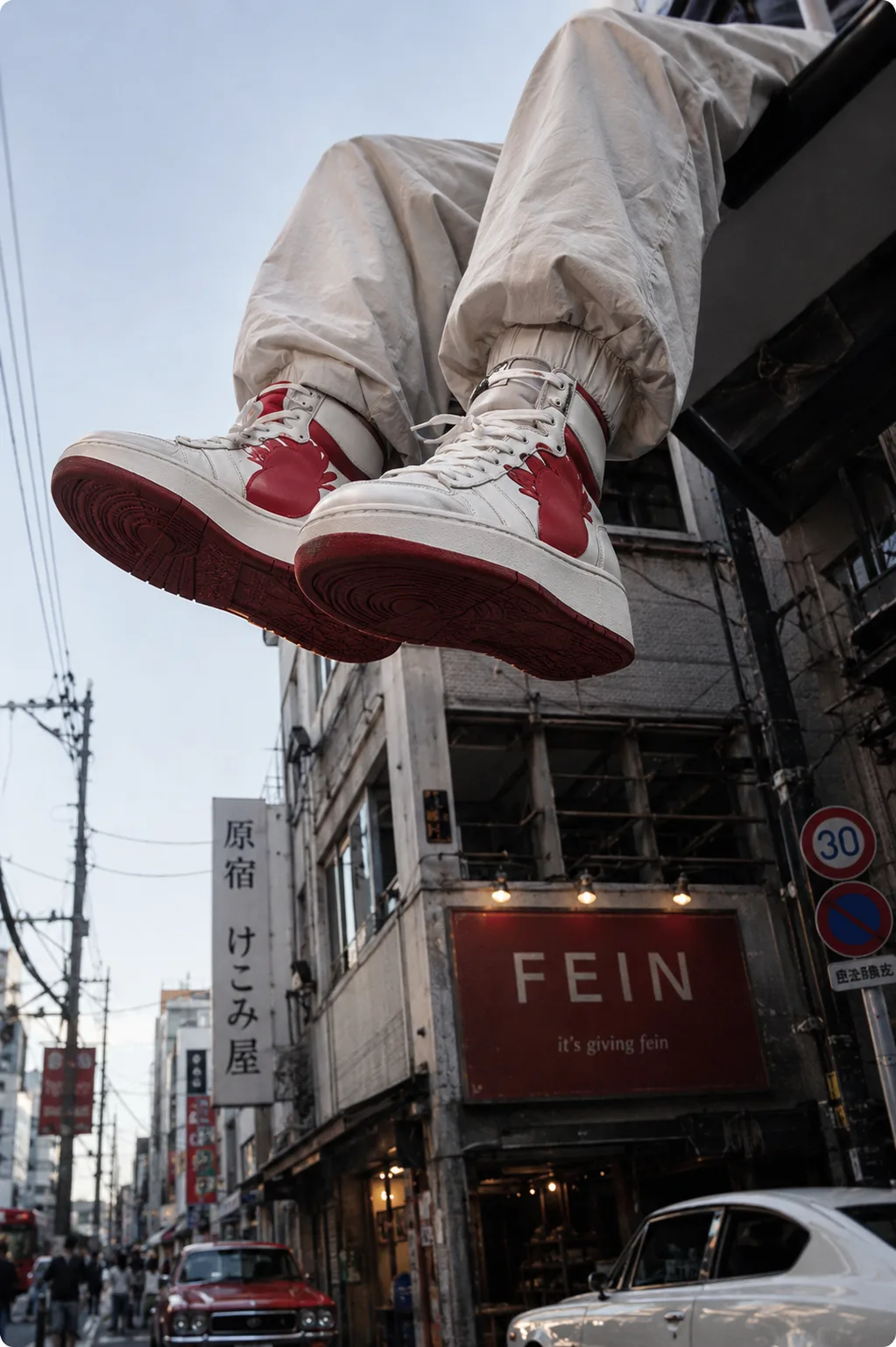 editorial worm's-eye street-style photograph of dangling legs over tokyo
