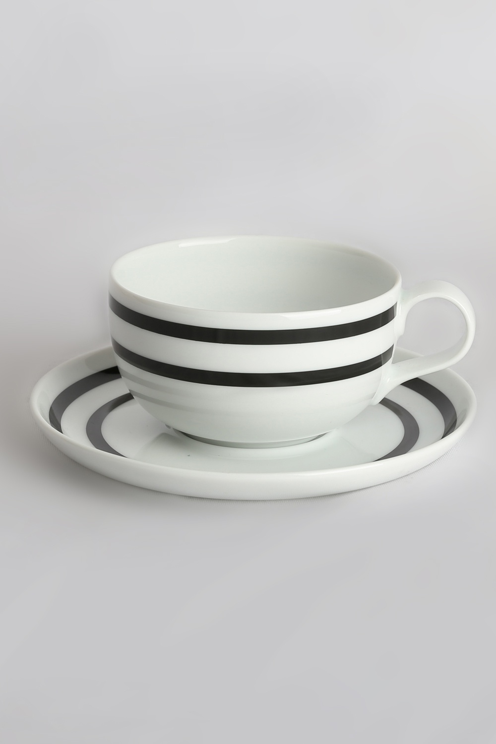 Odel Tea Cup And Saucer Ceramic Black Lines On White Base