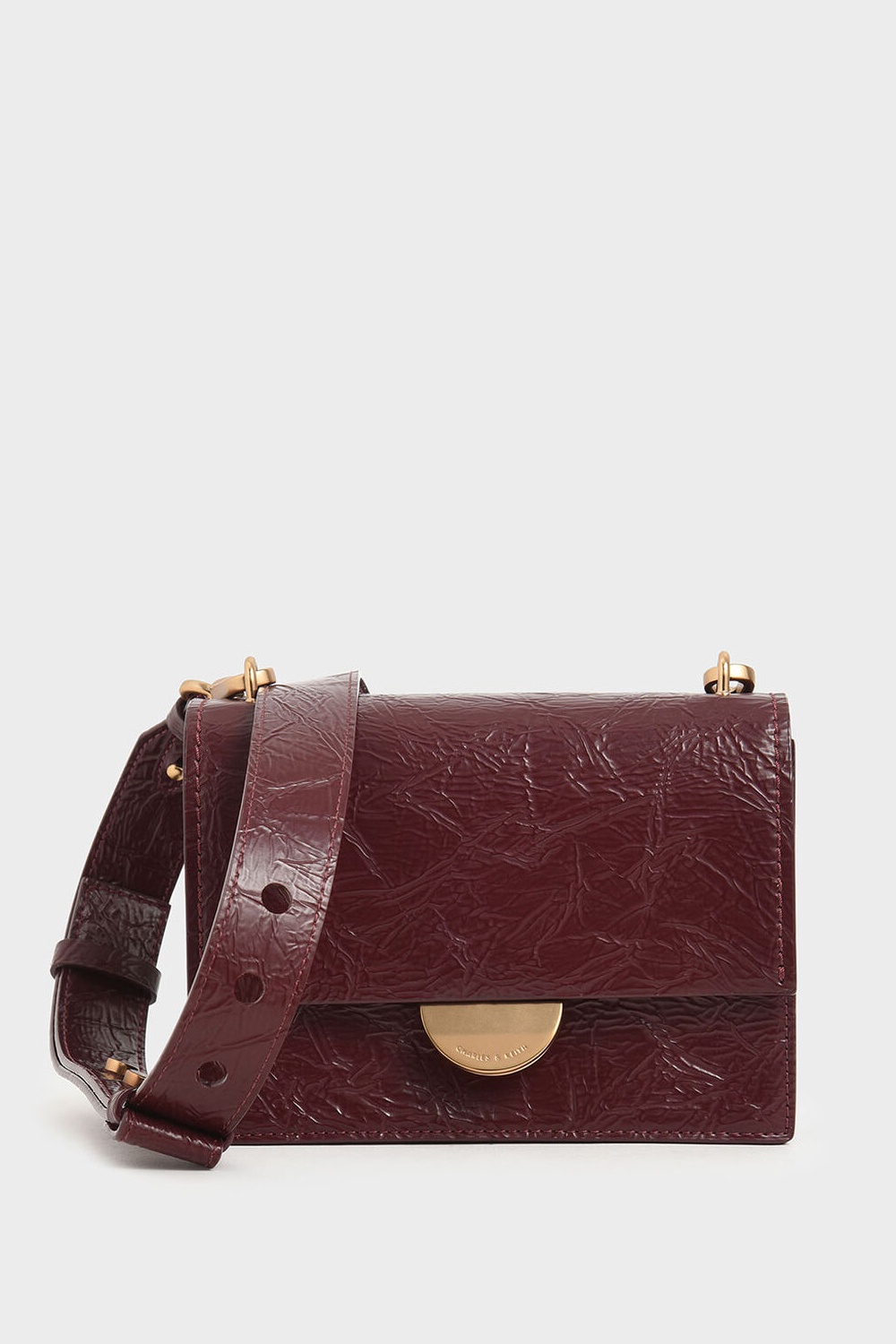 charles and keith wrinkled effect saddle bag